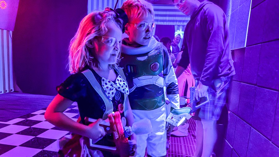 Two kids participating in Cosmic Carnival, a Seattle Halloween event for families
