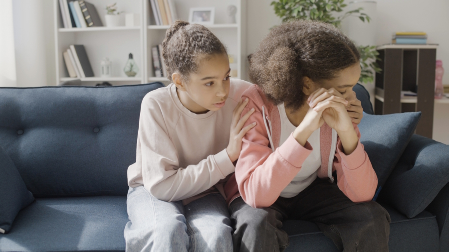Teen girl showing empathy to another teen girl