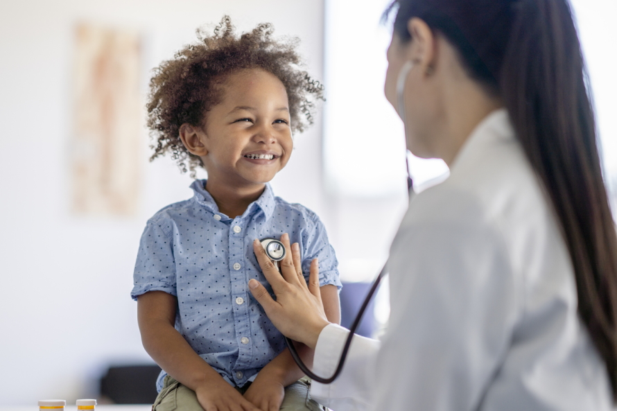 Young boy smiling at a doctor check up