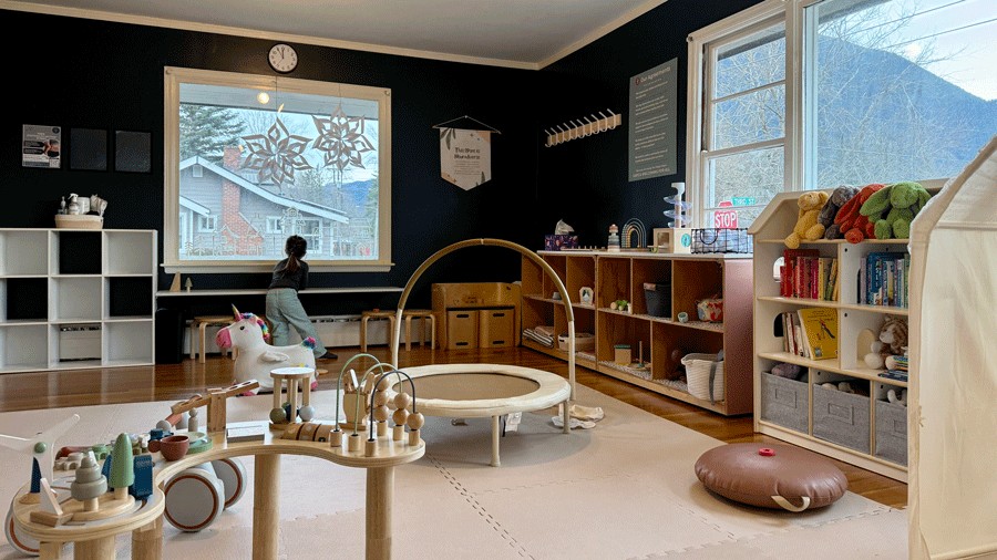 young girl playing in the indoor play space at The Village Project