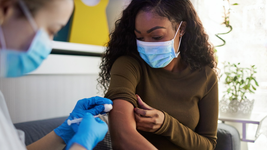masked-woman-getting-vaccine