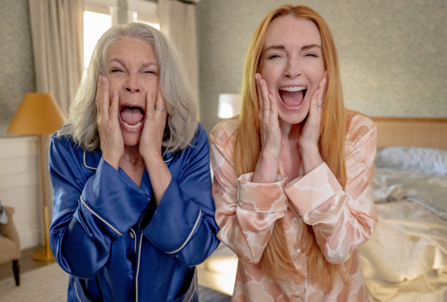 Two women looking in the mirror screaming with their hands on their face, from the movie “Freakier Friday”