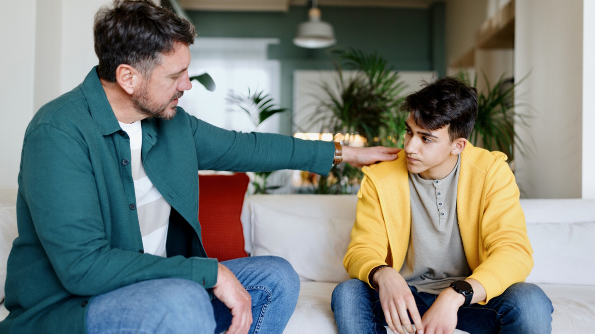 Dad supporting his teenage son with mental health