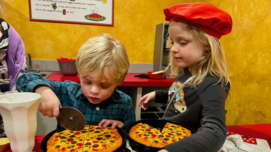 Young kids play pretend at the Piccolo Cafe at Imagine Children’s Museum in Everett 