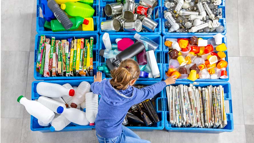 kid with recycling