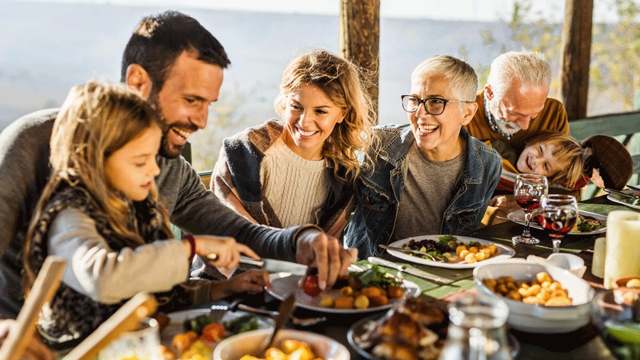 family enjoying a takeout Thanksgiving meal from local restaurants in the Seattle, Bellevue area serving Thanksgiving dinner