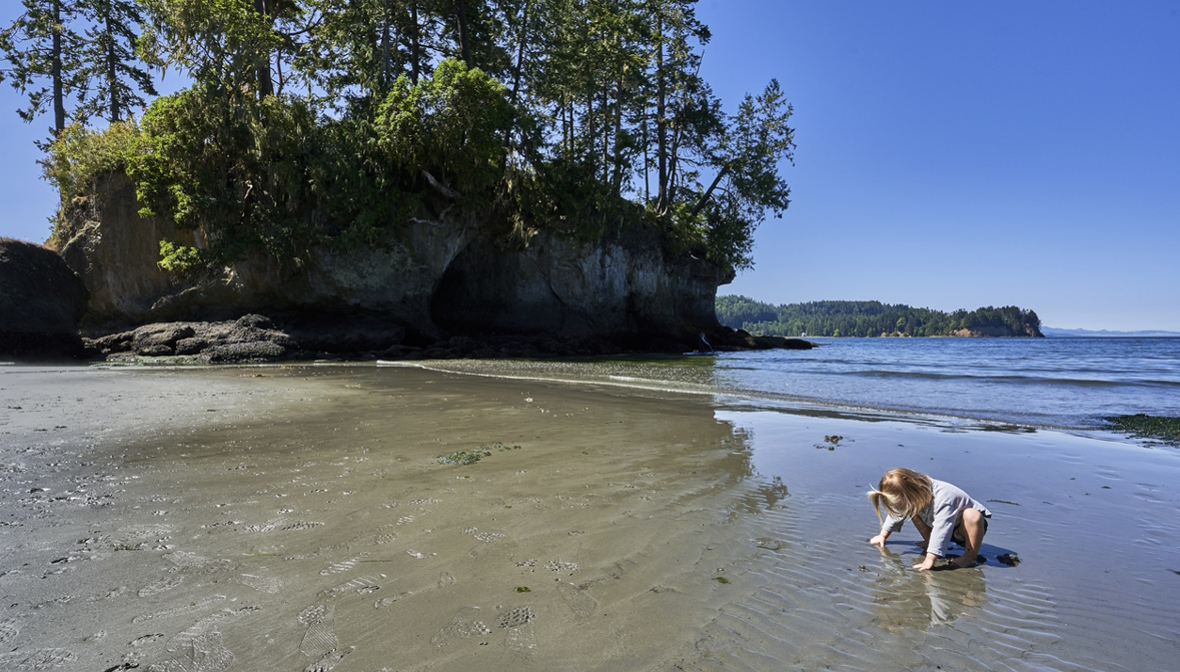 Toddler playing at the beach at Olympic National Park