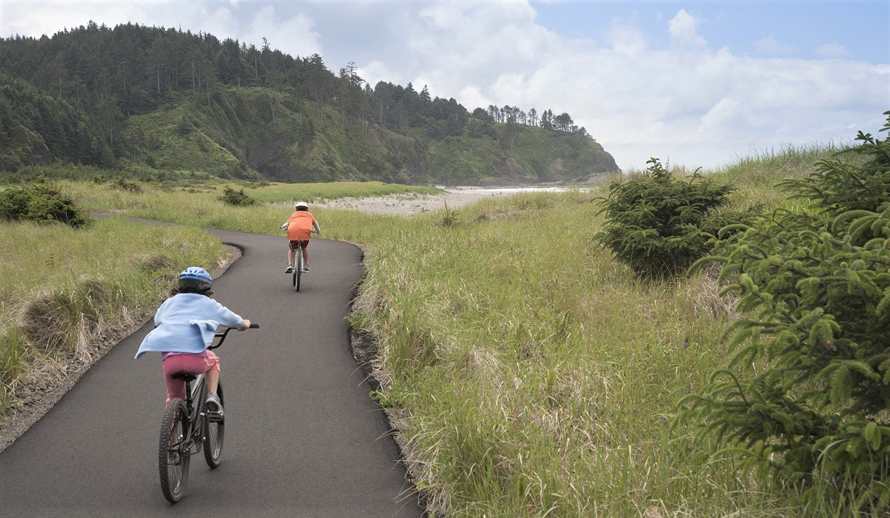 Long Beach Discovery Trail kids riding bikes by the ocean