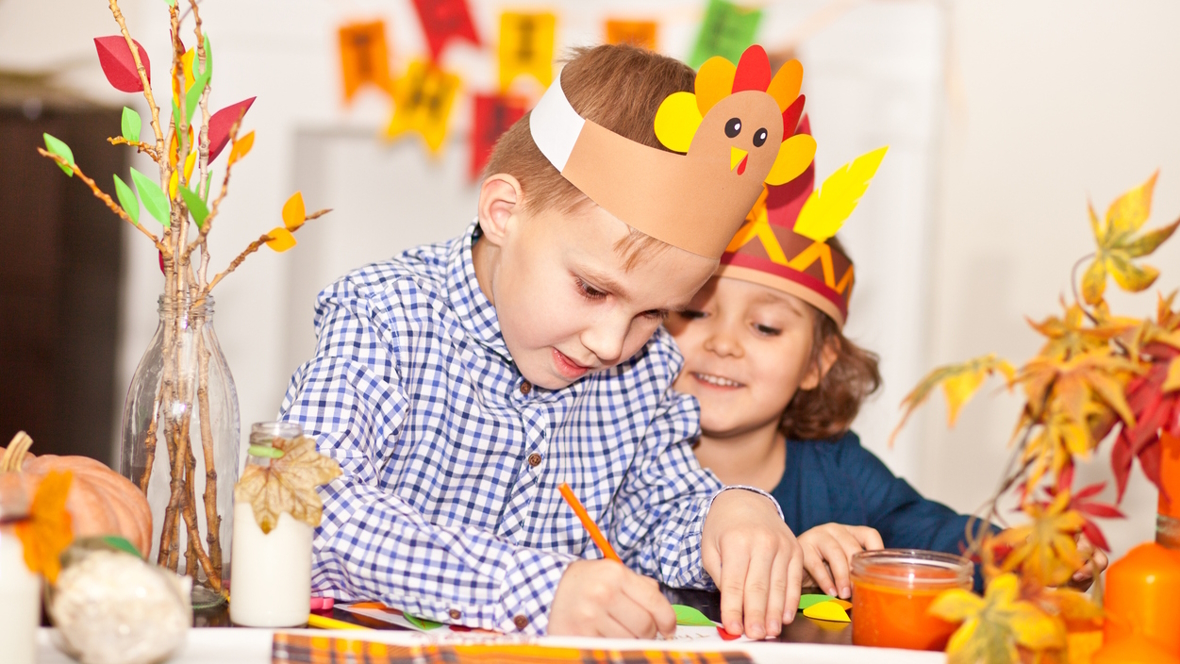 Kids working on a Thanksgiving craft project