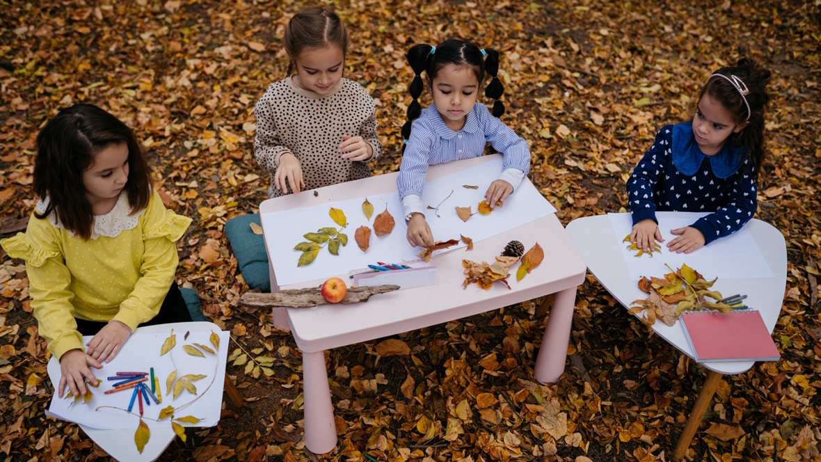 Kids collecting fall leaves