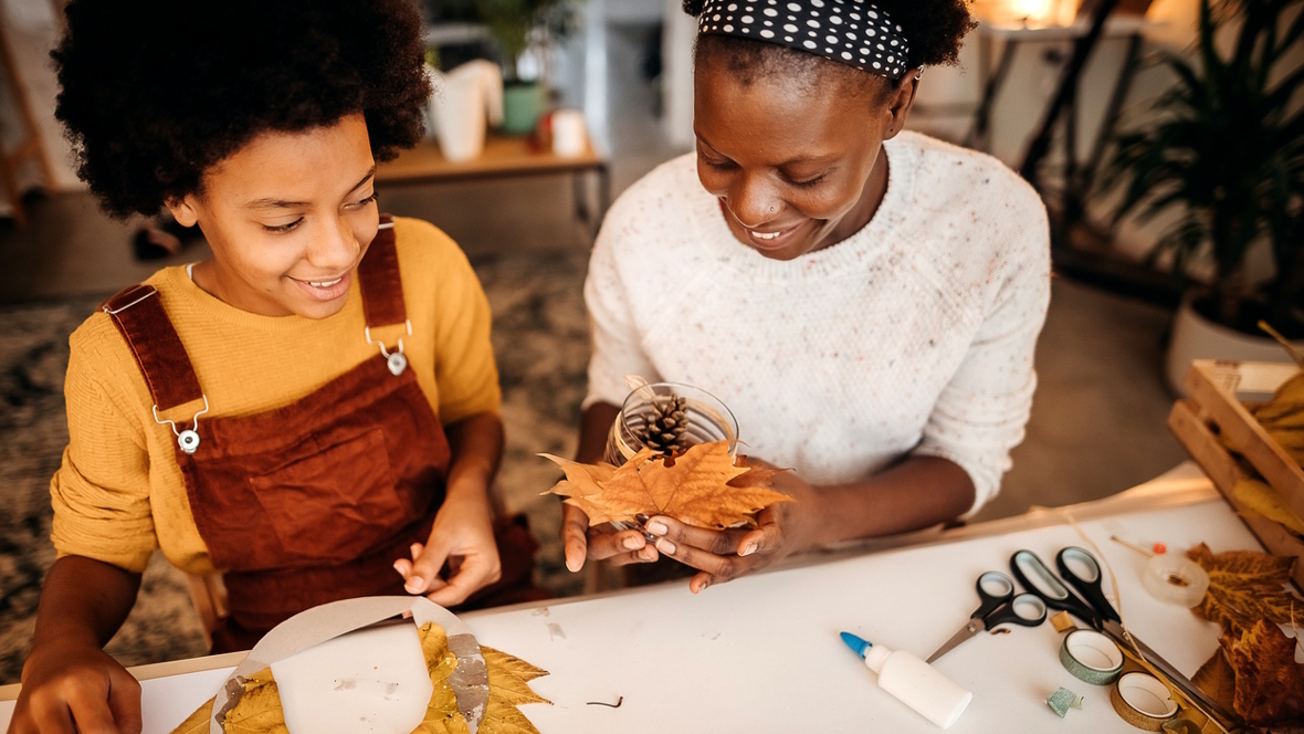 mom and child working on Thanksgiving crafts