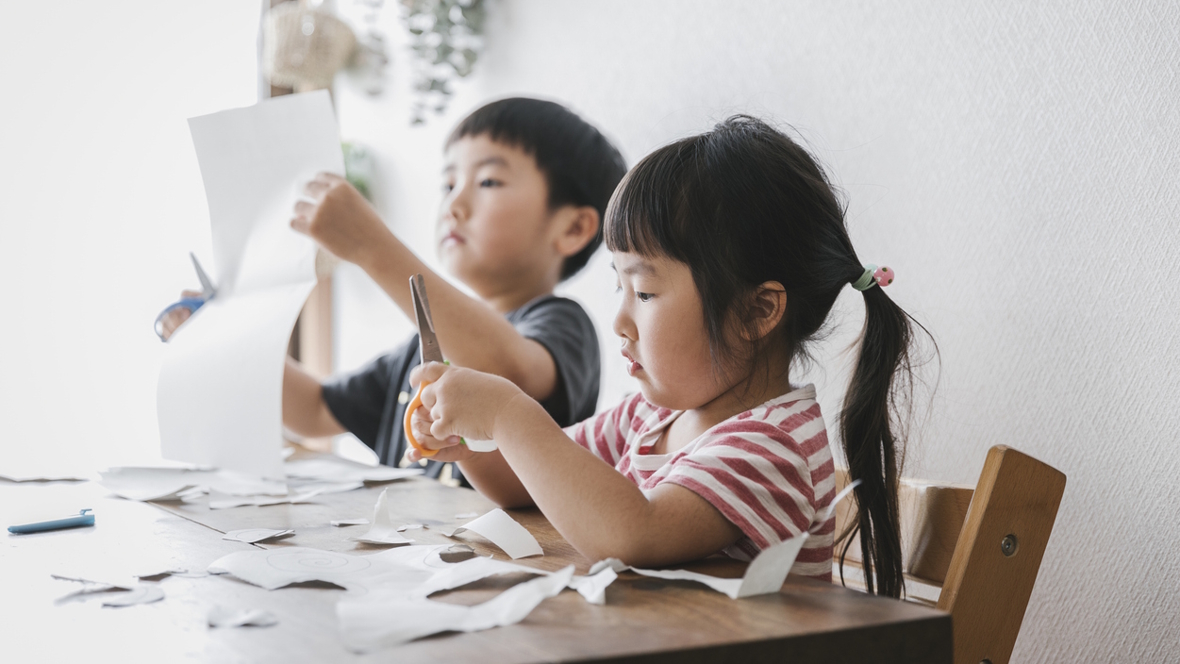 brother and sister working on summer time crafts
