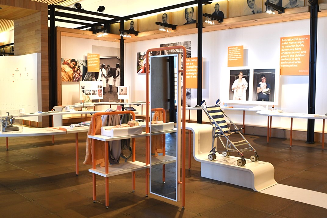 At the interactive baby-wearing station, try a doll in three different baby carriers and take a look in the mirror