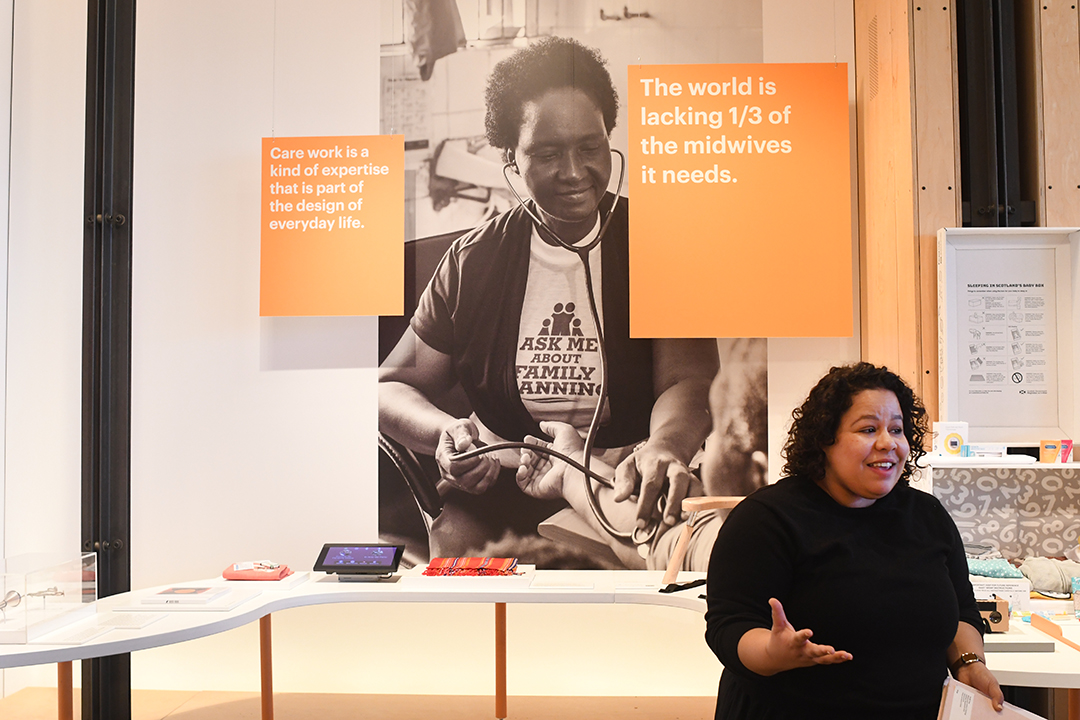 Designing Motherhood Co-curator Juliana Rowen Barton leads a tour through the exhibit