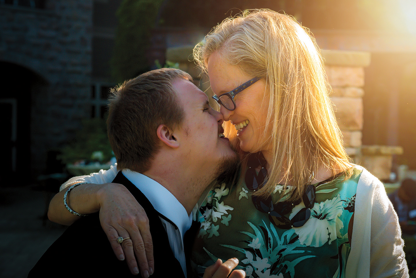 mother and teen son smiling nose to nose
