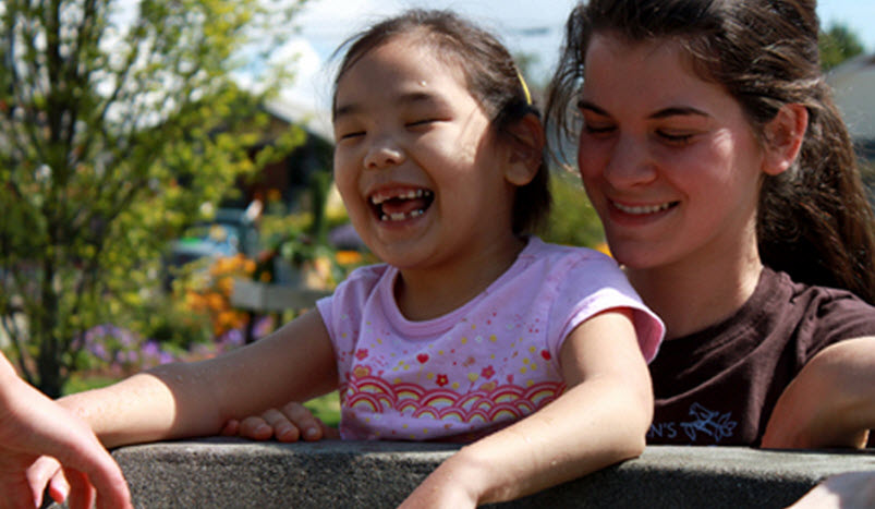Child and teacher at Children's Playgarden