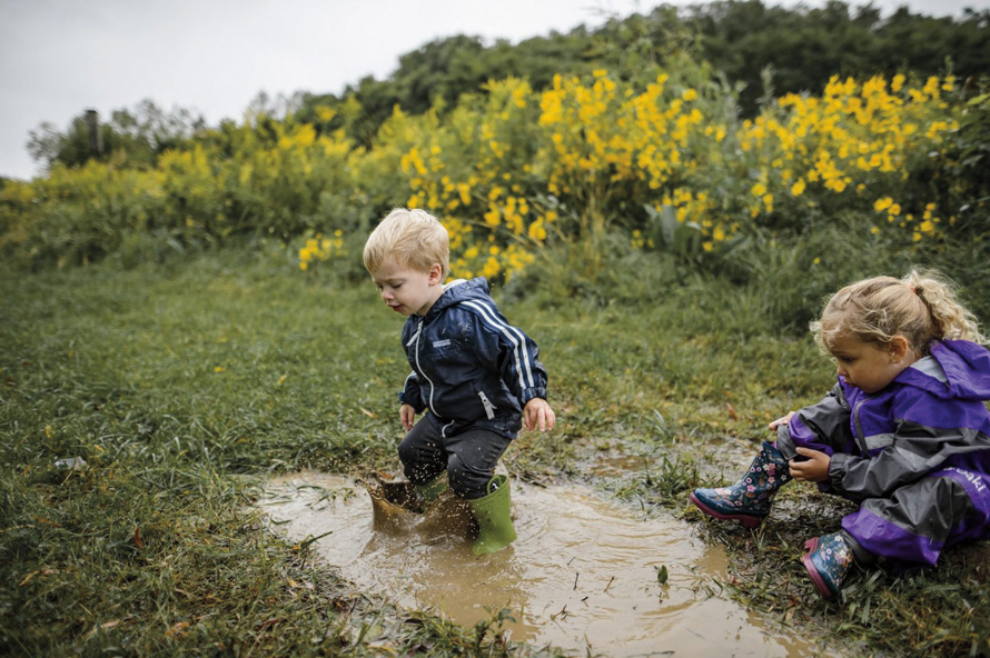 kids playing in a mudpuddle
