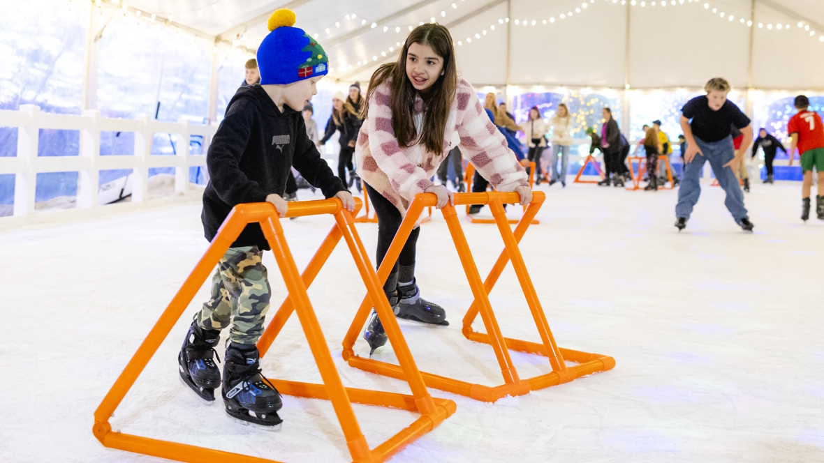 kids ice skating together at Tulalip Lights and Ice
