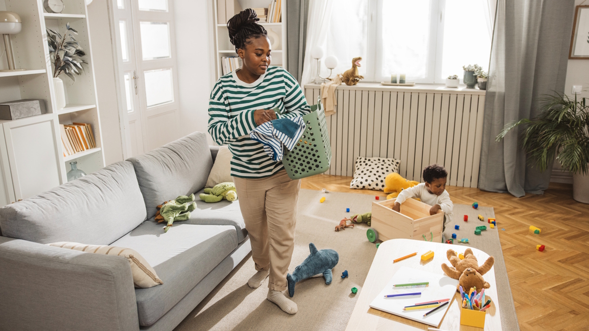 mom and kids picking up toys