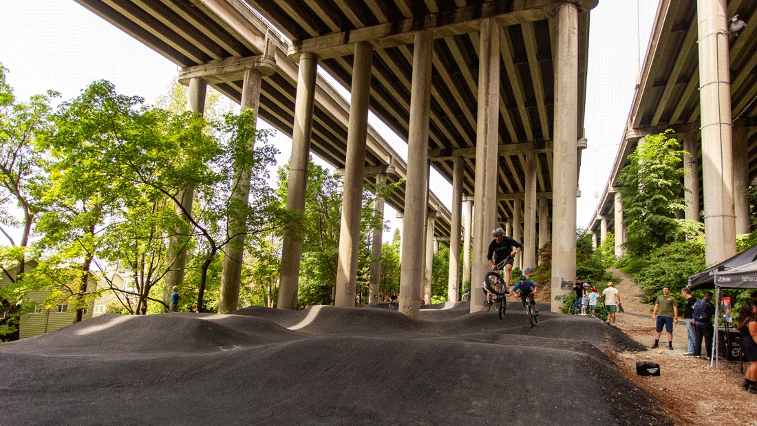 bikers on the new pump track at I-5 Colonnade Park in Seattle