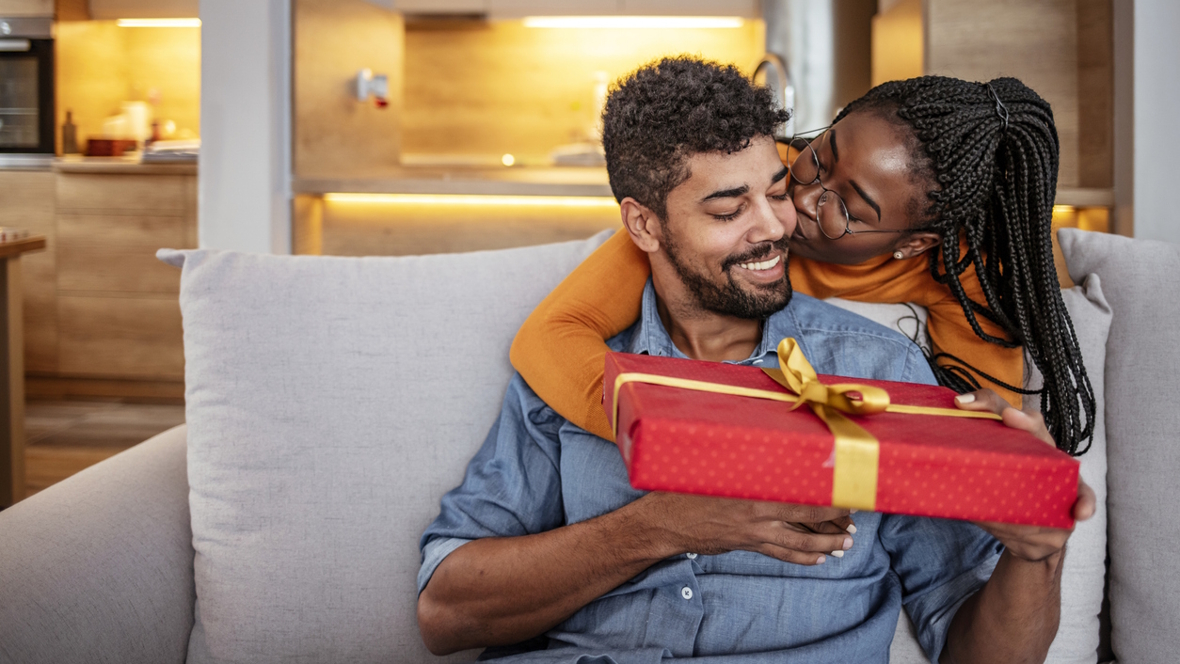 couple on Valentine's day giving gifts and smiling