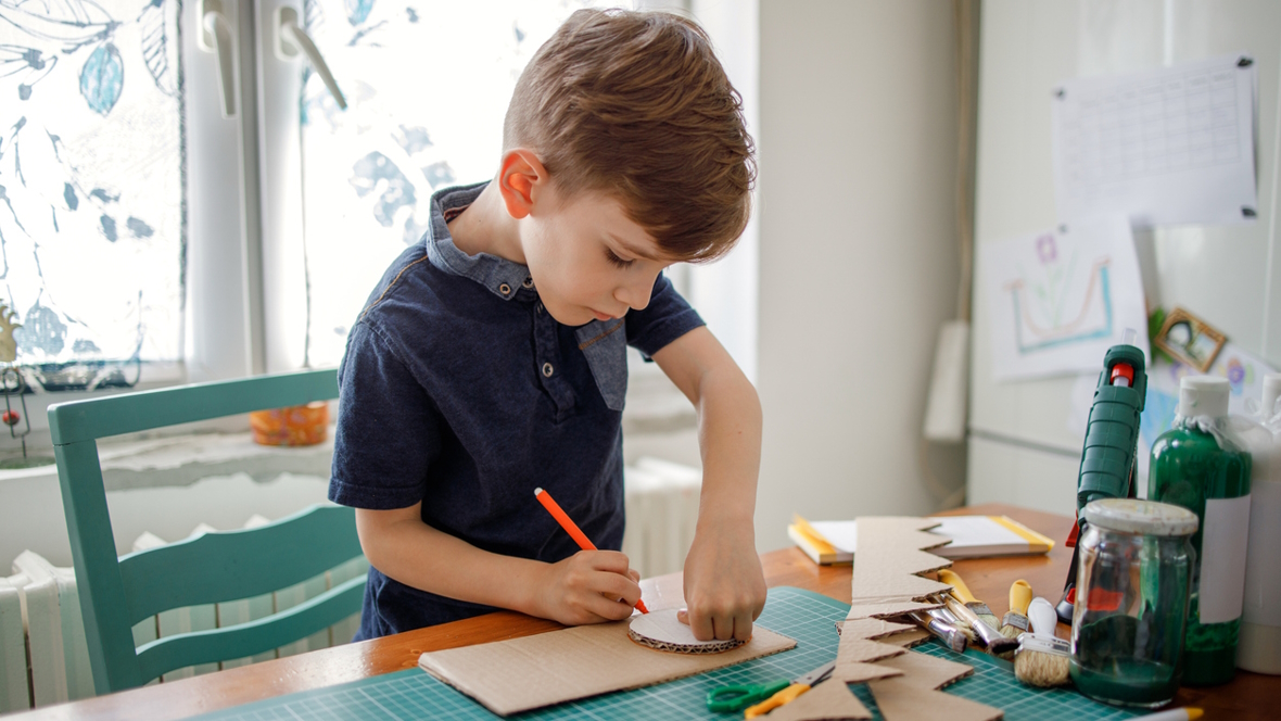 boy cutting out monster jaws