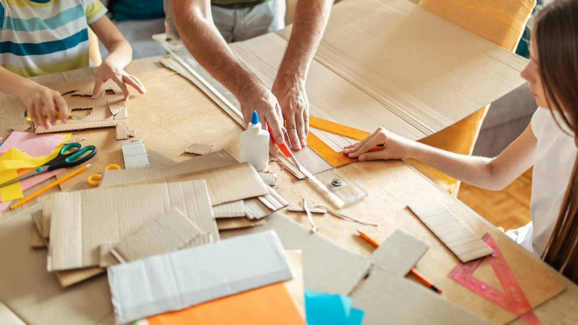 cutting up cardboard to make stackers