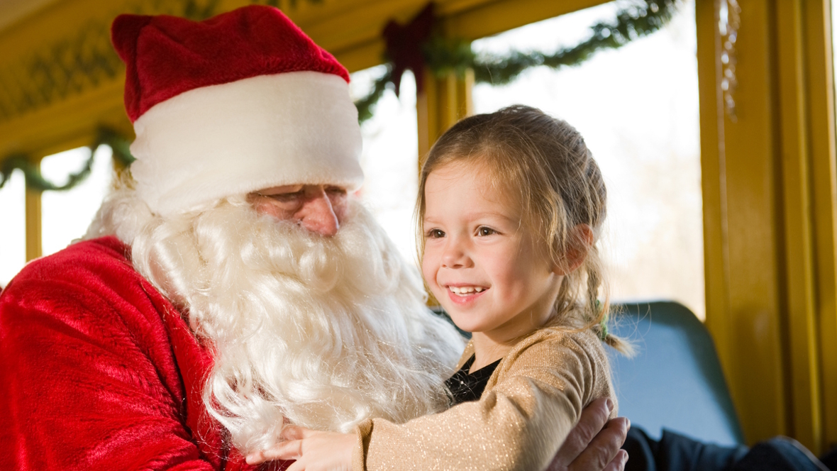 Santa and a kid on a train