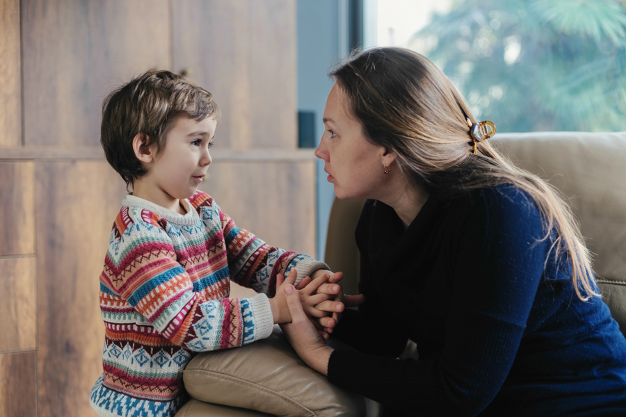 Mom listening to her son who looks upset