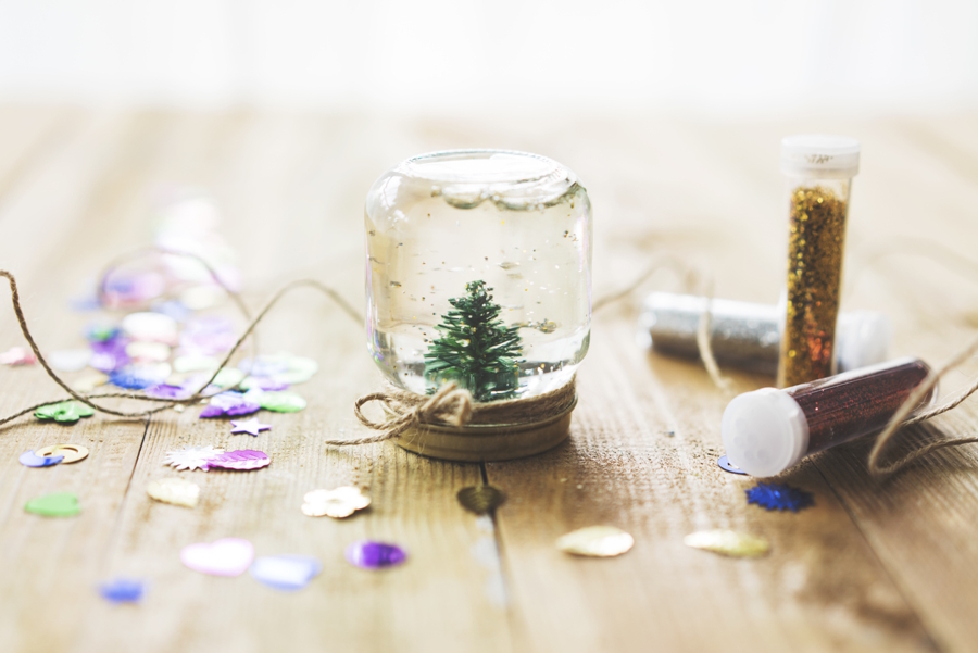 Homemade snow globe with a small tree