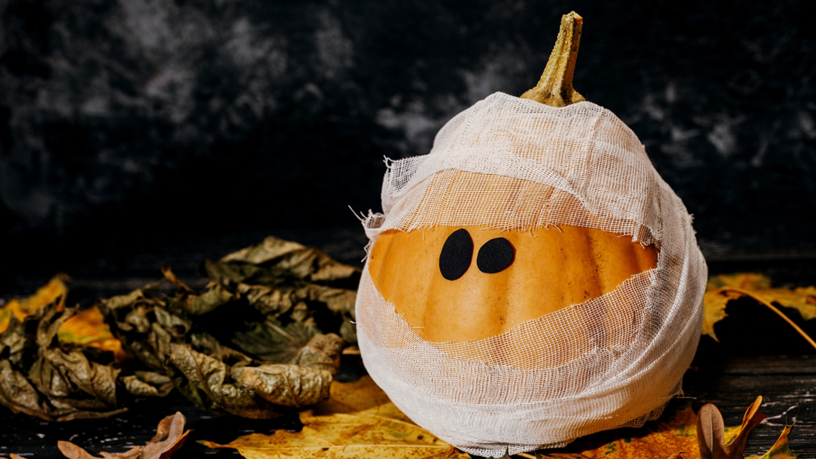 pumpkin decorated like a mummy