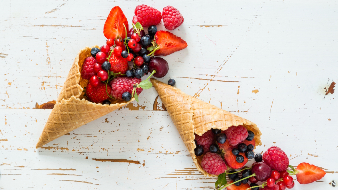ice cream cone overflowing with fruit