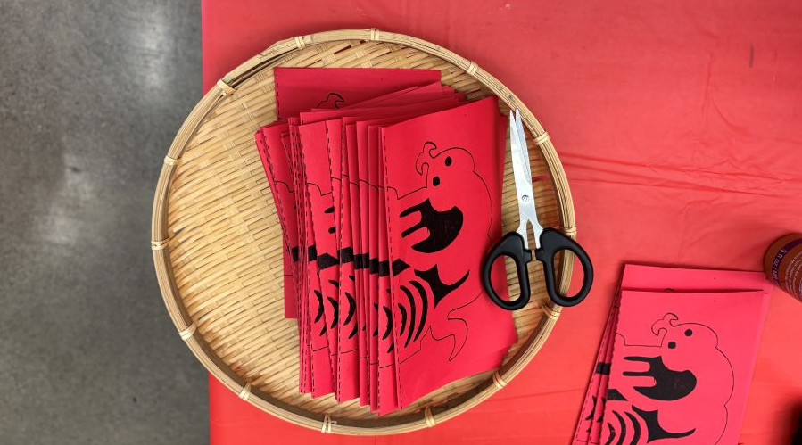 Paper Lunar New Year cut-outs are part of the craft fun during Lunar New Year events.