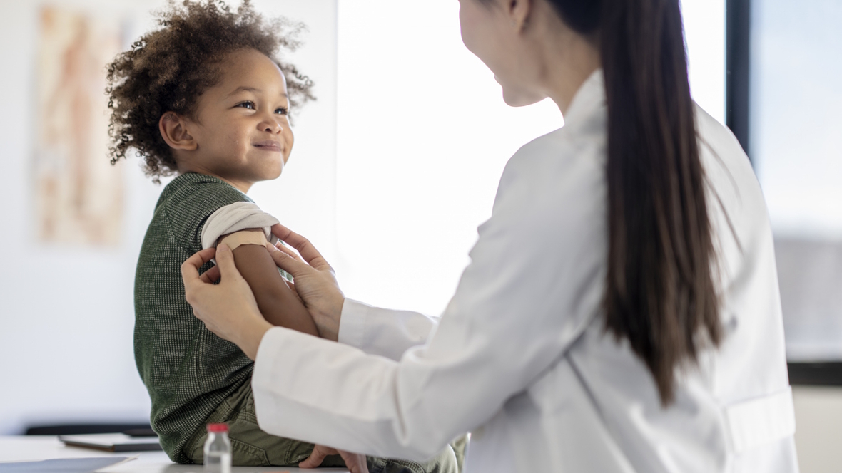 child receiving a measles vaccine