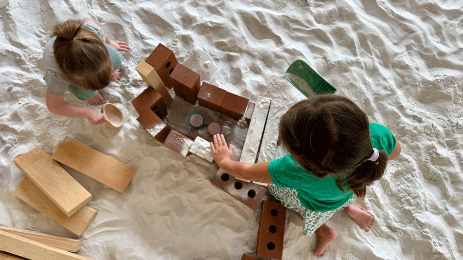 kids playing and building in an indoor sandbox in Issaquah