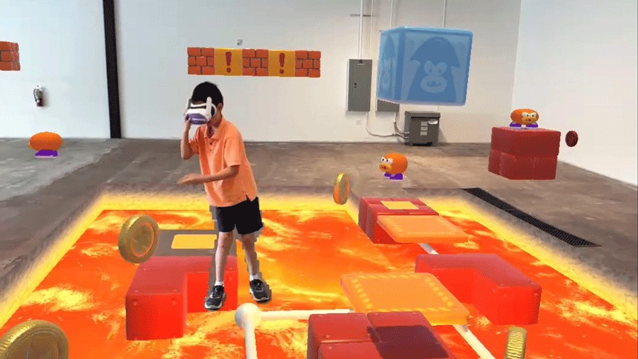 young boy wearing VR headset and standing on lava floors at DreamPark Seattle, a mixed-reality theme park in the city