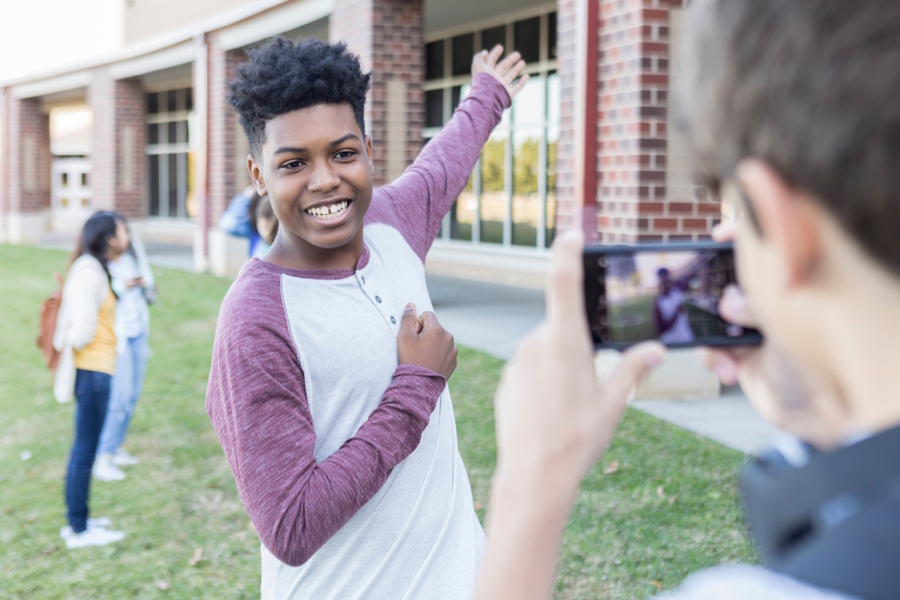 boy taking a photo on a college tour
