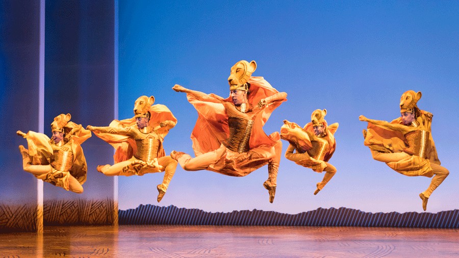 Lionesses dance onstage during The Lion King musical, now in Seattle at Paramount Theatre