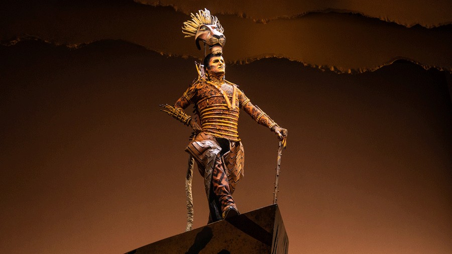 Scar takes his place onstage during The Lion King musical