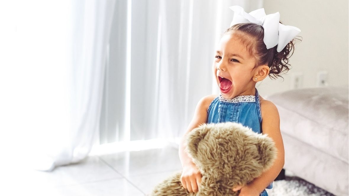 screaming little girl toddler playing at home