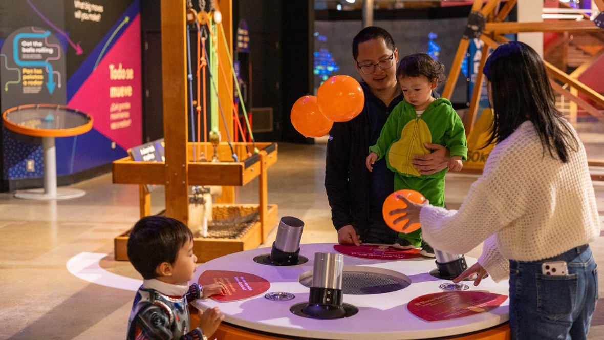 family having fun at Pacific Science Center