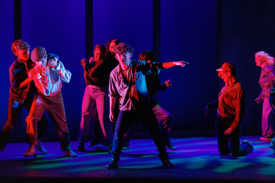 cast from The Outsiders on stage performing 
