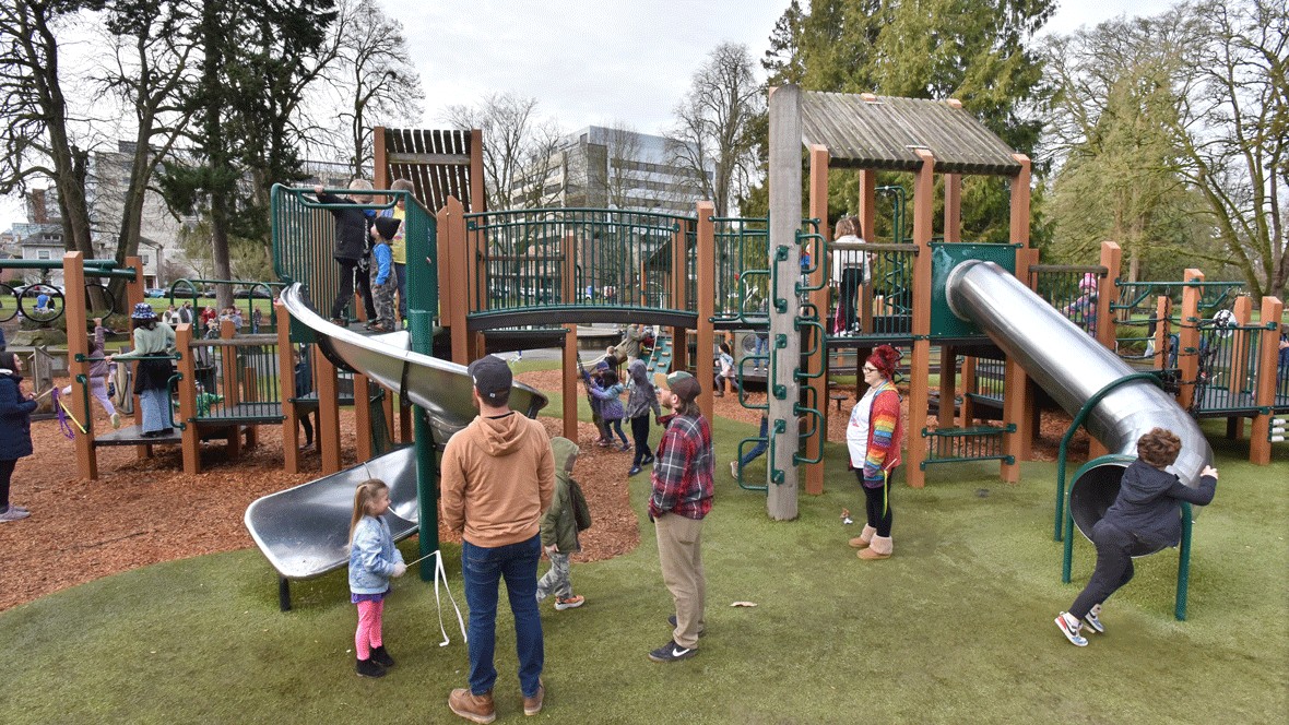 families playing on the playground at Wright Park