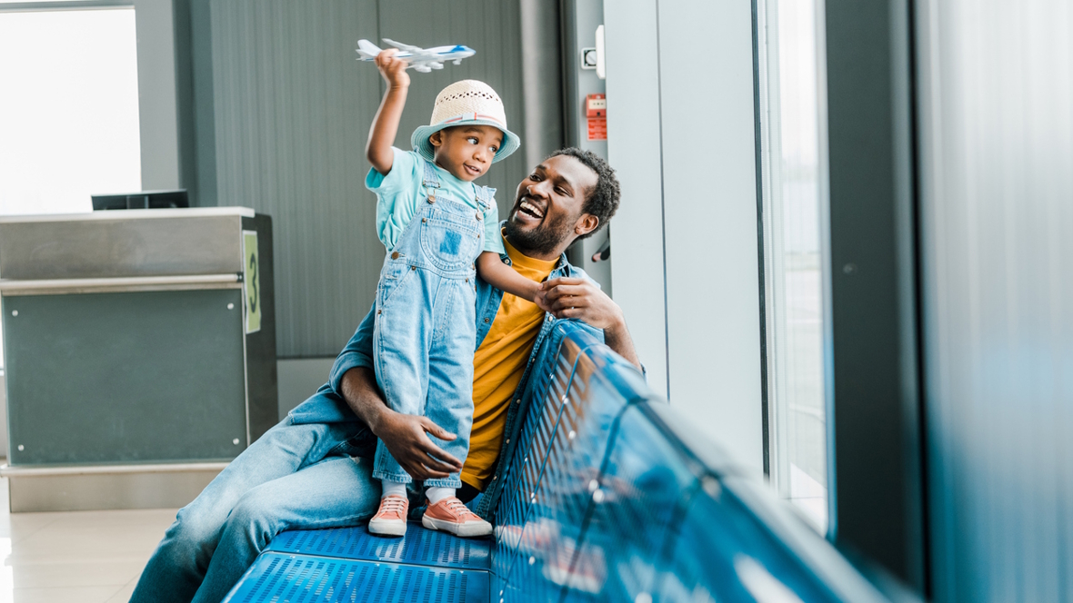 dad at an airport with his son