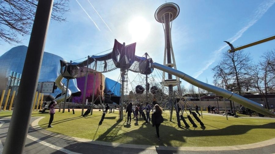 artists at play playground with space need in background
