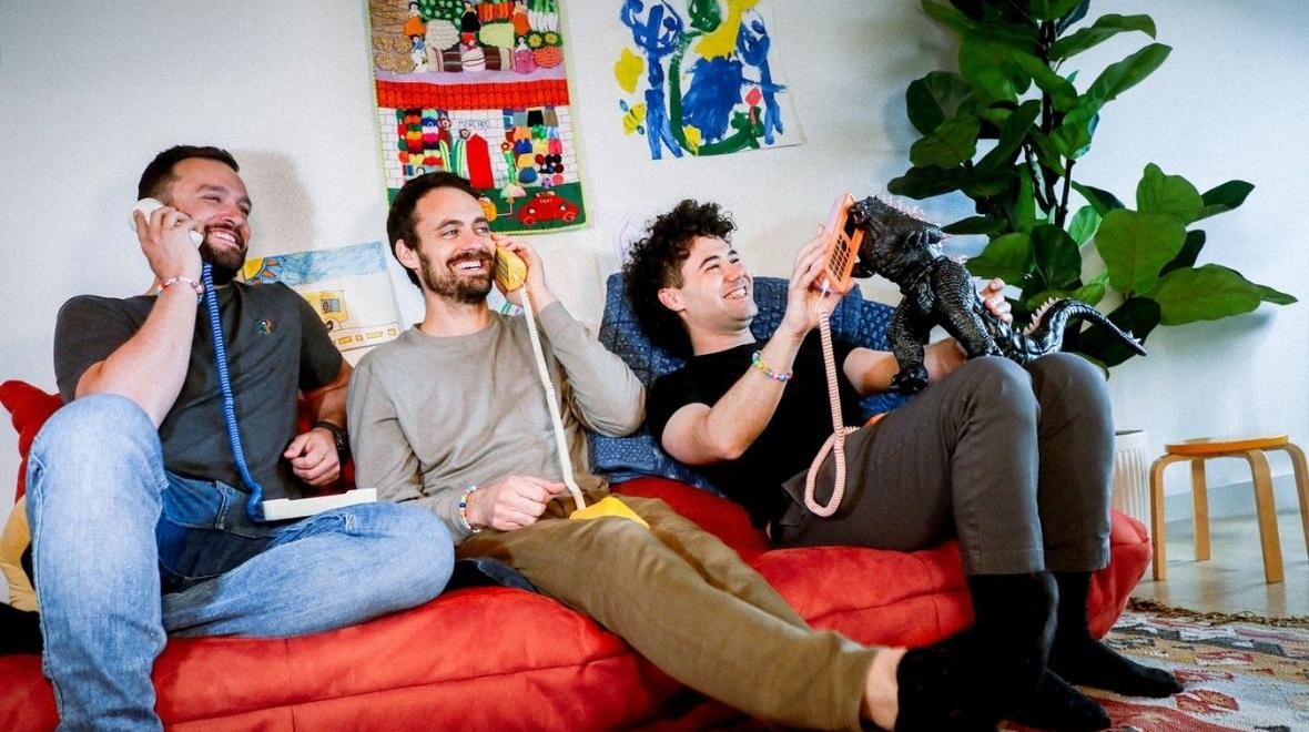 Tin Can's founders sitting on a couch together