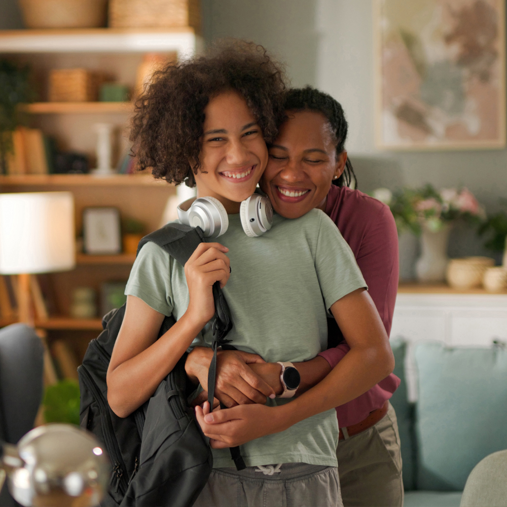Mom and teen son embracing