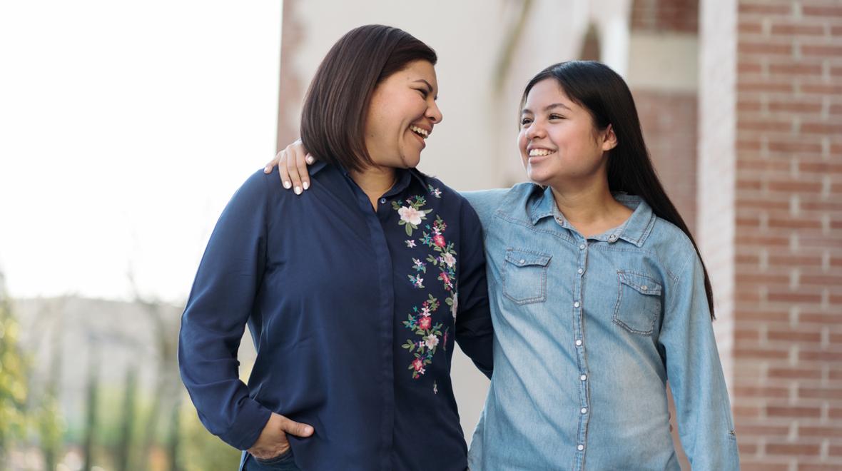 mom and teen girl together smiling