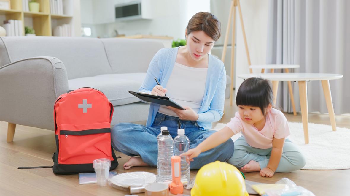mom and daughter packing a go bag together