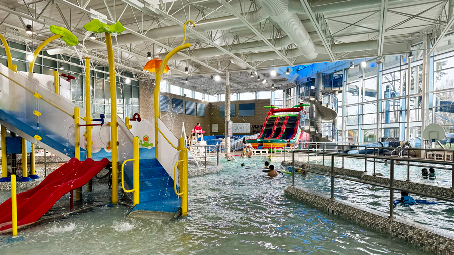 view of the indoor pool, slide and play area at Snohomish Aquatic Center, where families can buy a season pass